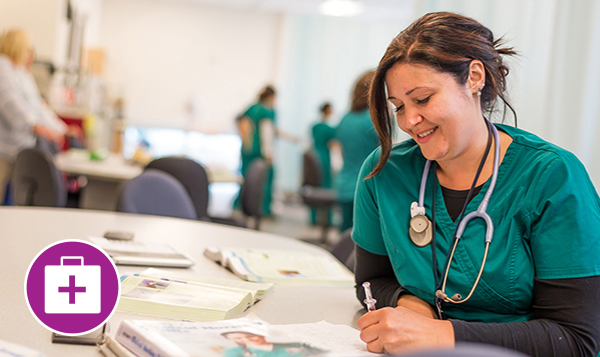 Nursing student studying in a lab classroom