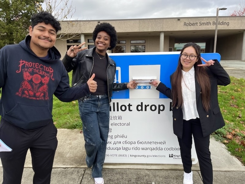 Student In font of the Ballot Box