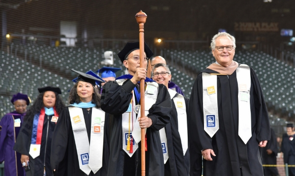 Seattle Colleges Chancellor Shouan Pan leads the graduation processional at the 2019 Commencement Ceremony