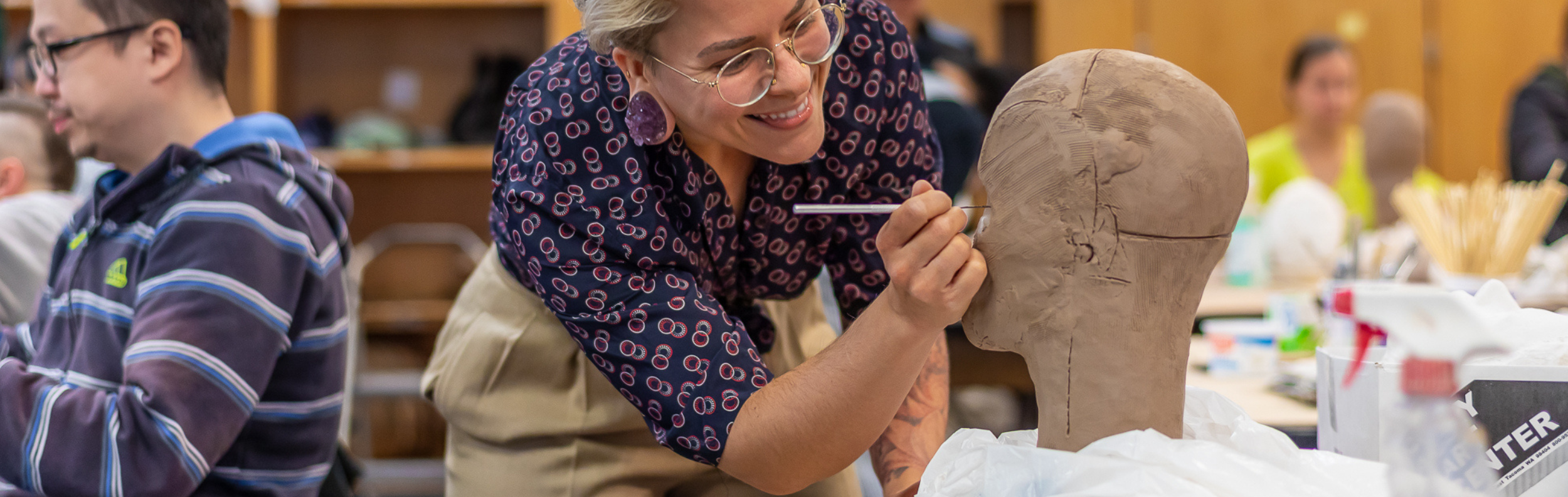  Pottery student working on a clay project 